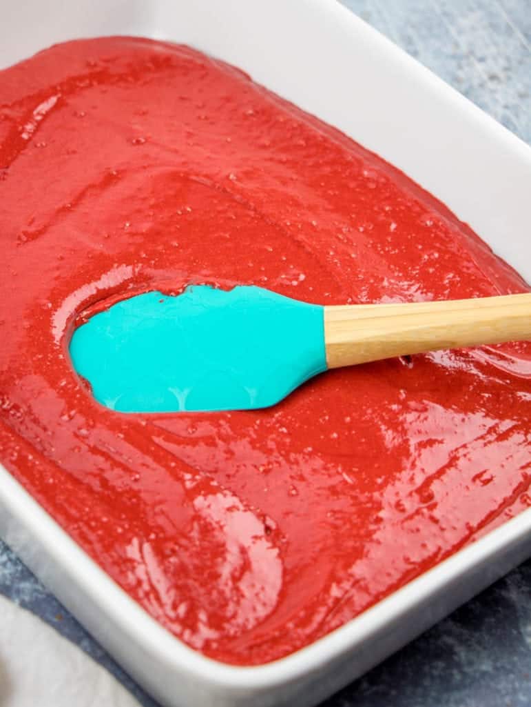 prepared red velvet cake mix batter in a baking dish.