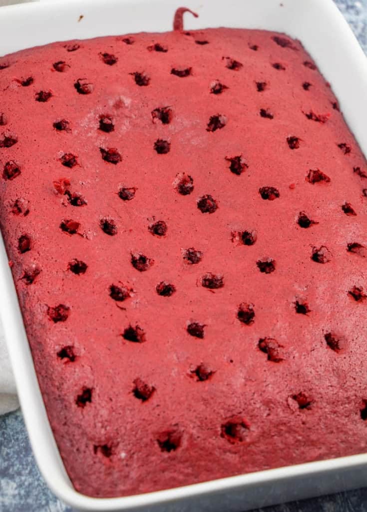 poked holes in a red velvet cake
