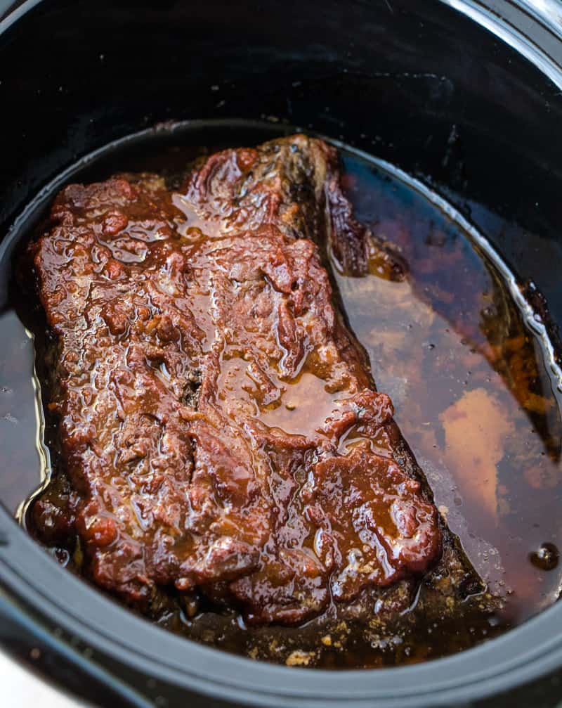 fully cooked bbq beef brisket in a crock pot