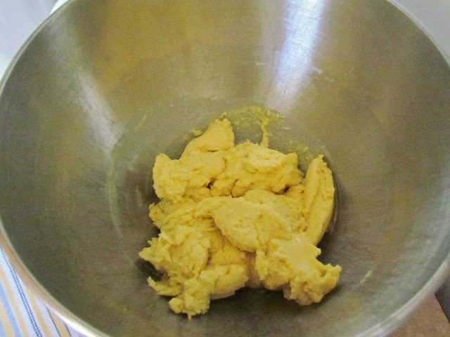 cake mix, butter and egg mixed together in a stand mixer.