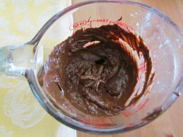 melted chocolate chips in a measuring cup.