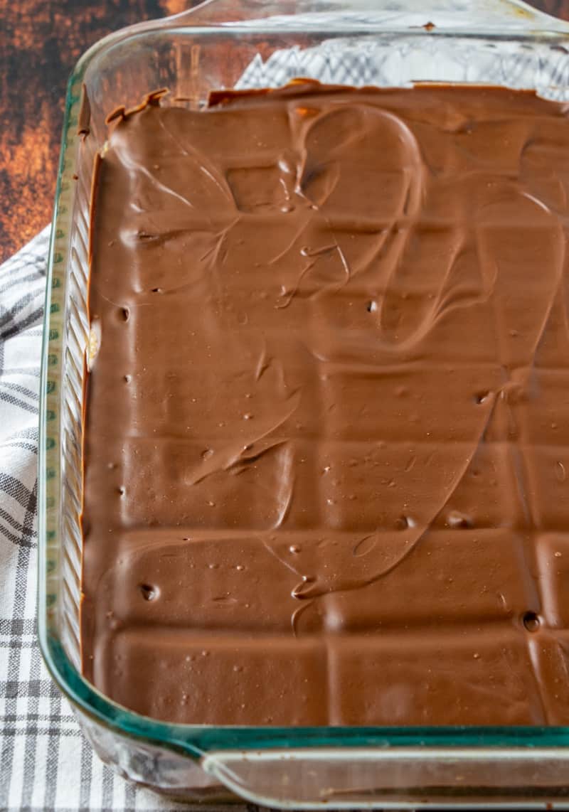 homemade Kit Kat Bars (before cutting) in a Pyrex baking dish after they have cooled.