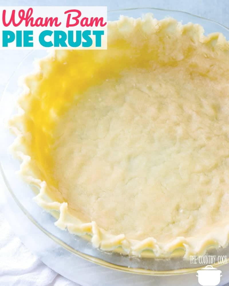 pie crust shown unbaked in a pie pan with the edges of the crust shown crimped.