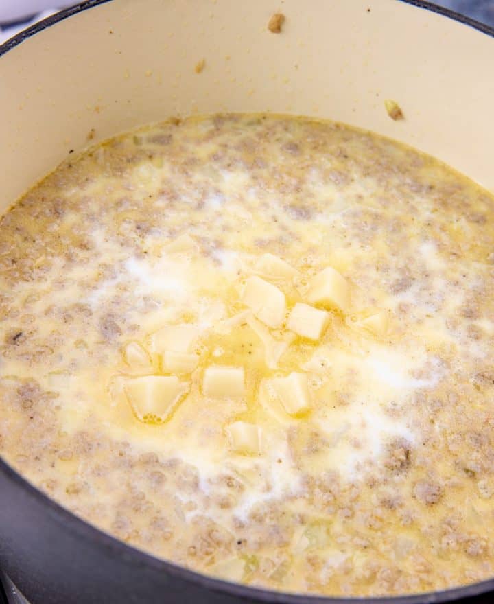 diced potatoes and cream corn added to soup mixture in dutch oven.