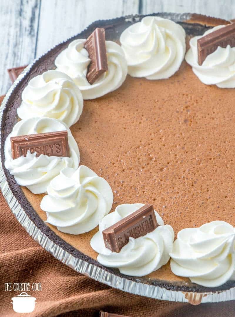 Hershey Chocolate Pie with whipped cream and small chocolate bars.