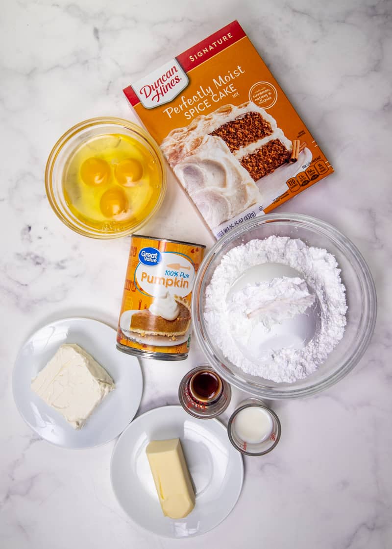 spice cake mix, canned pumpkin puree, large eggs, cream cheese, butter, powdered sugar, vanilla extract, milk.