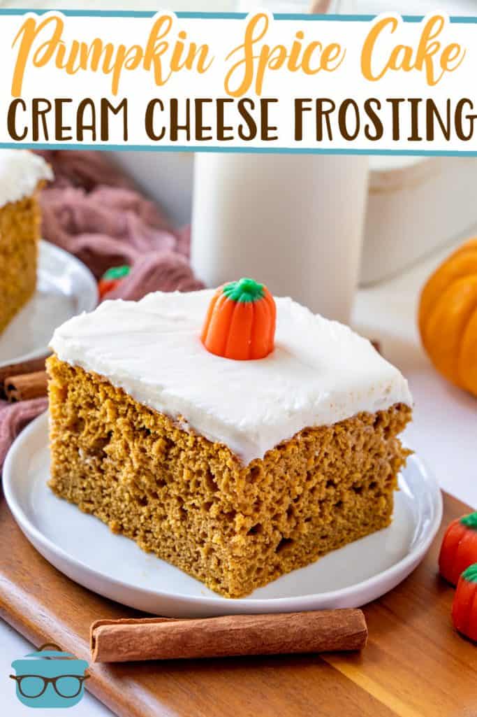 Pumpkin Spice Cake with Cream Cheese Frosting recipe from The Country Cook, slice shown on a small white plate and topped with a candy pumpkin