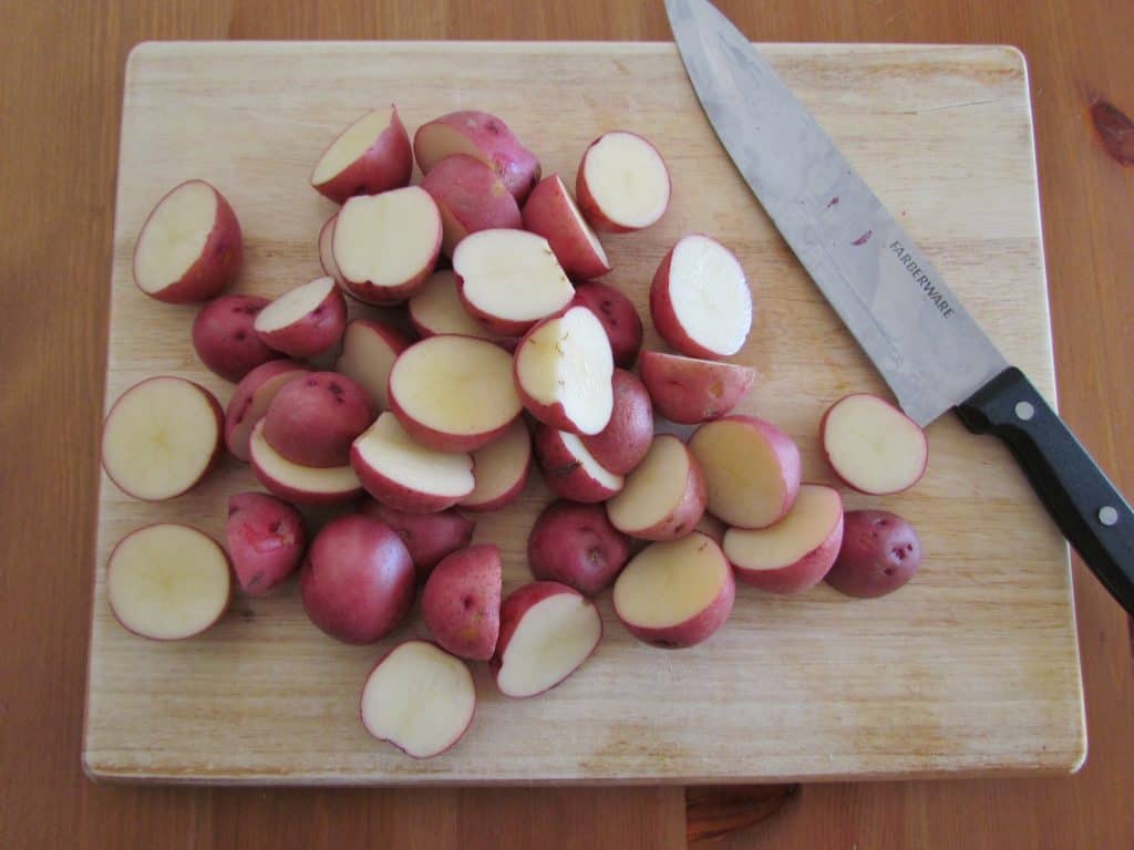 sliced red potatoes on a cutting board