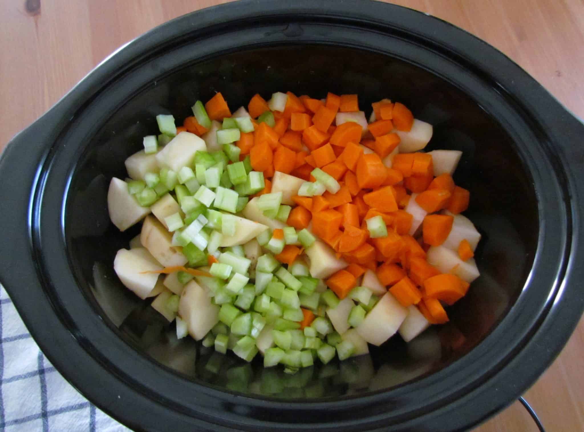 diced potatoes, diced celery, diced carrots, sliced leeks and cooked bacon.