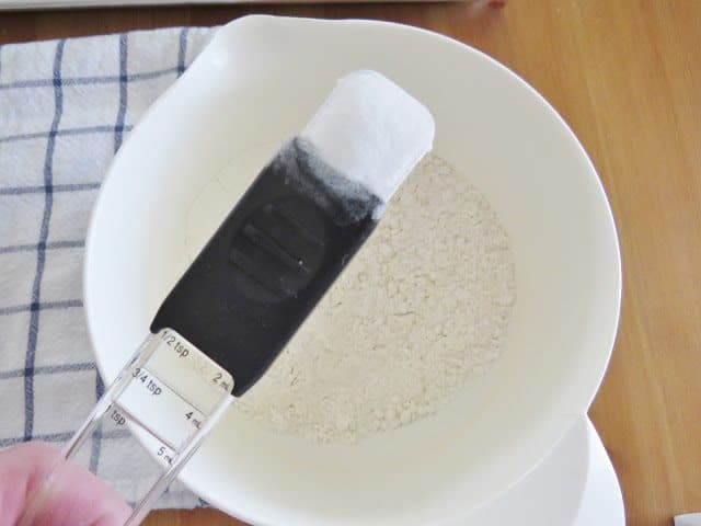 salt, baking soda and flour in a white mixing bowl