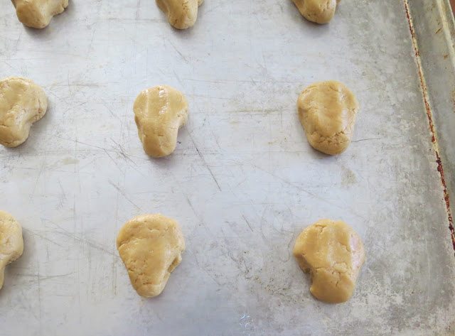 cooke dough balls being formed into the shape of a reindeer head. 