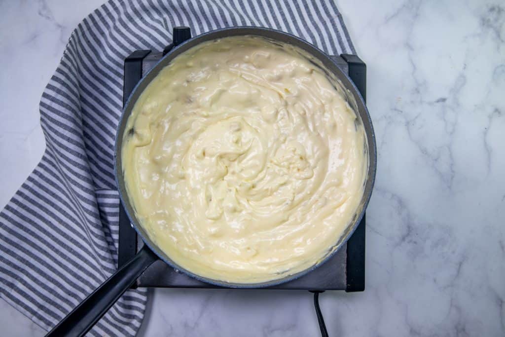 cream cheese, onion and garlic mixture stirred until smooth in a large skillet.