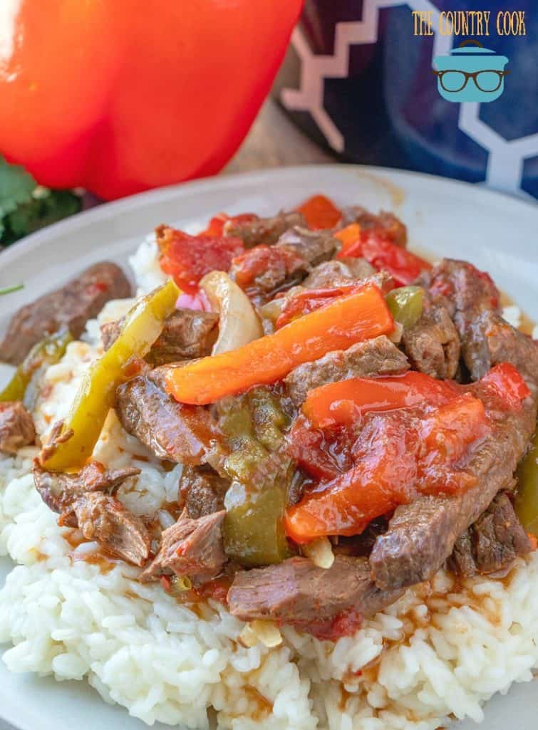 Slow Cooker Pepper Steak with tomatoes on rice