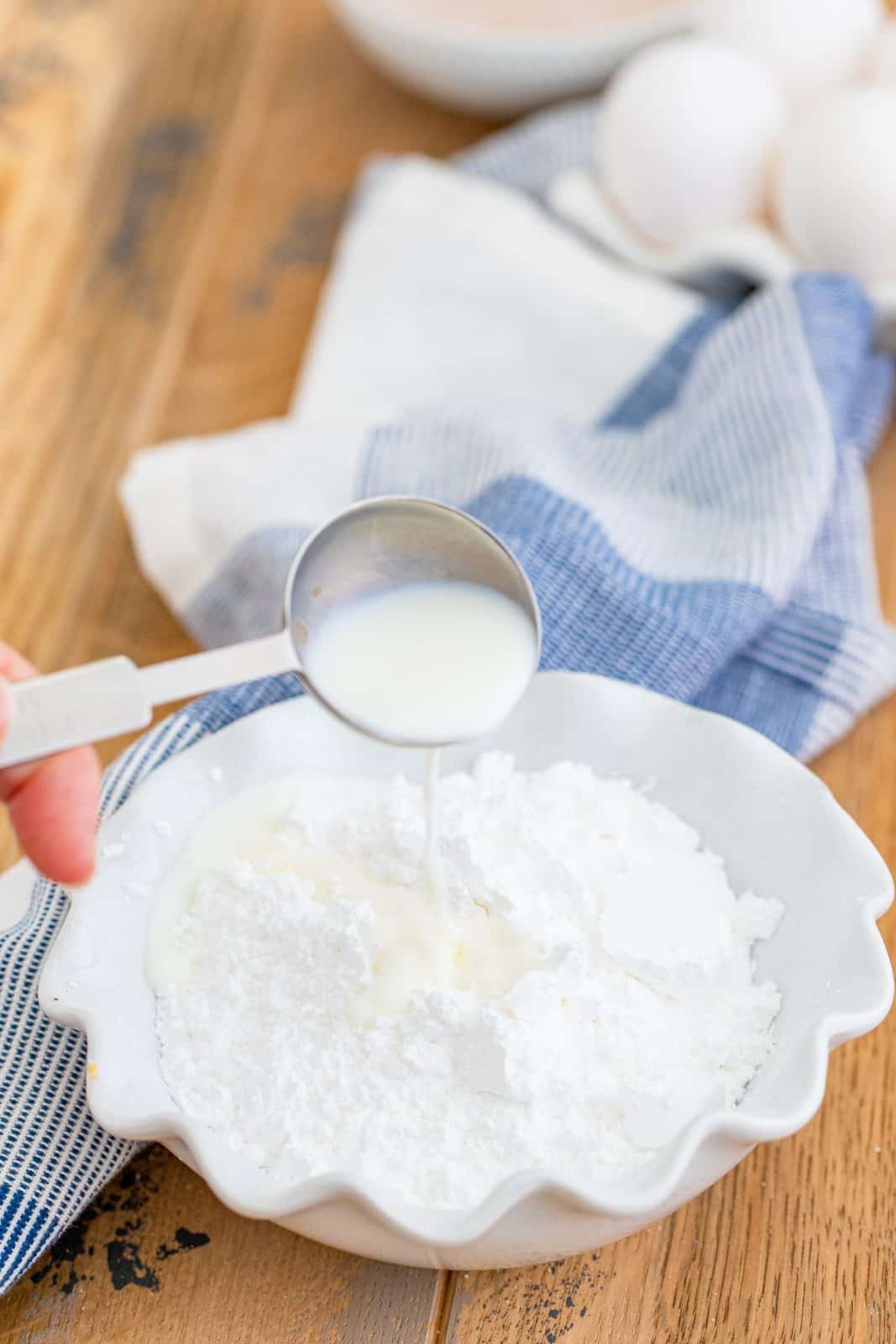 powdered sugar and milk in a bowl to make icing. 