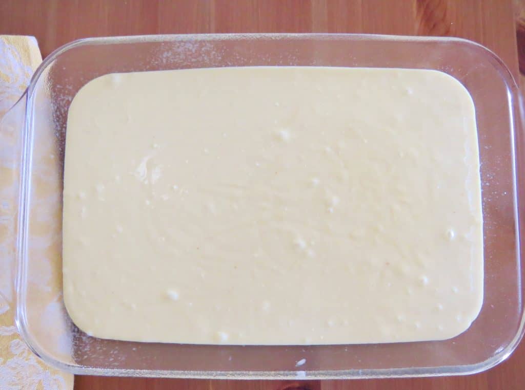 LEMON CAKE MIX PREPARED BATTER POURED INTO A 9X13 BAKING DISH