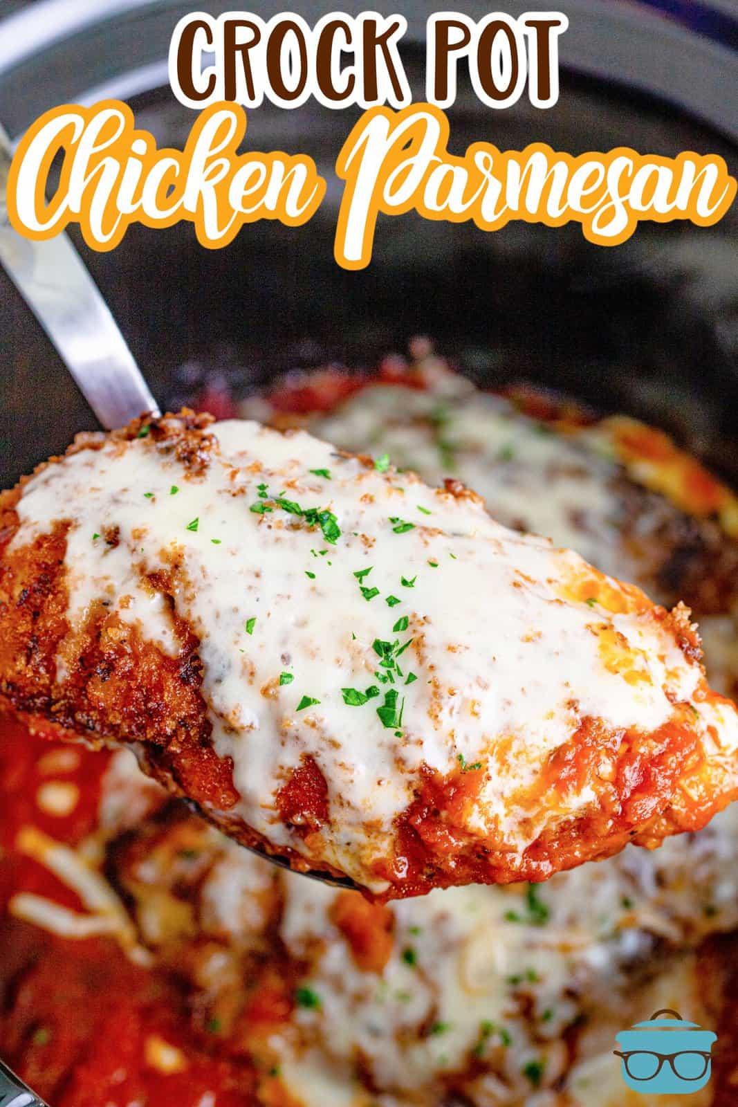Photo of Crock Pot Chicken Parmesan in a crock pot with a serving on a spoon to be served - by The Country Cook