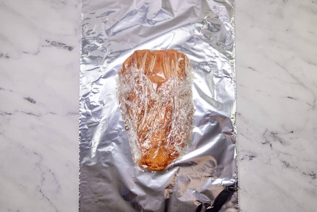 plastic wrapped seasoned chuck roast.