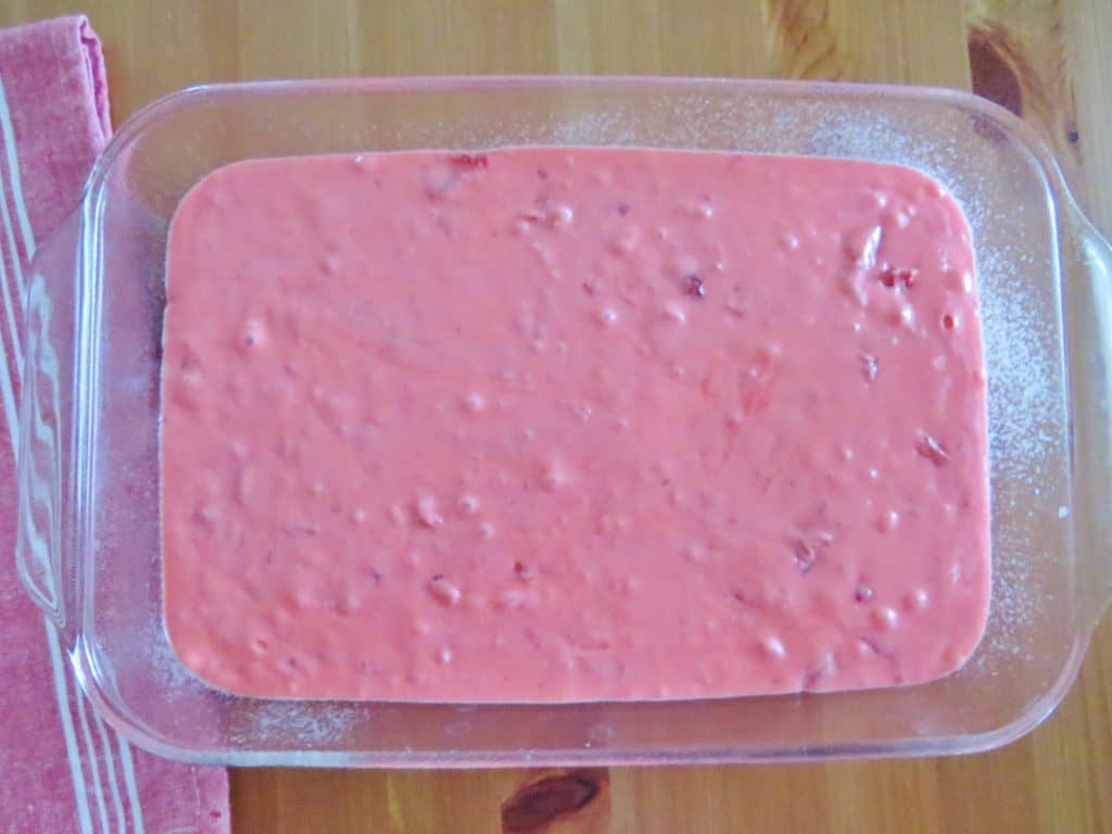 strawberry cake batter in clear baking dish