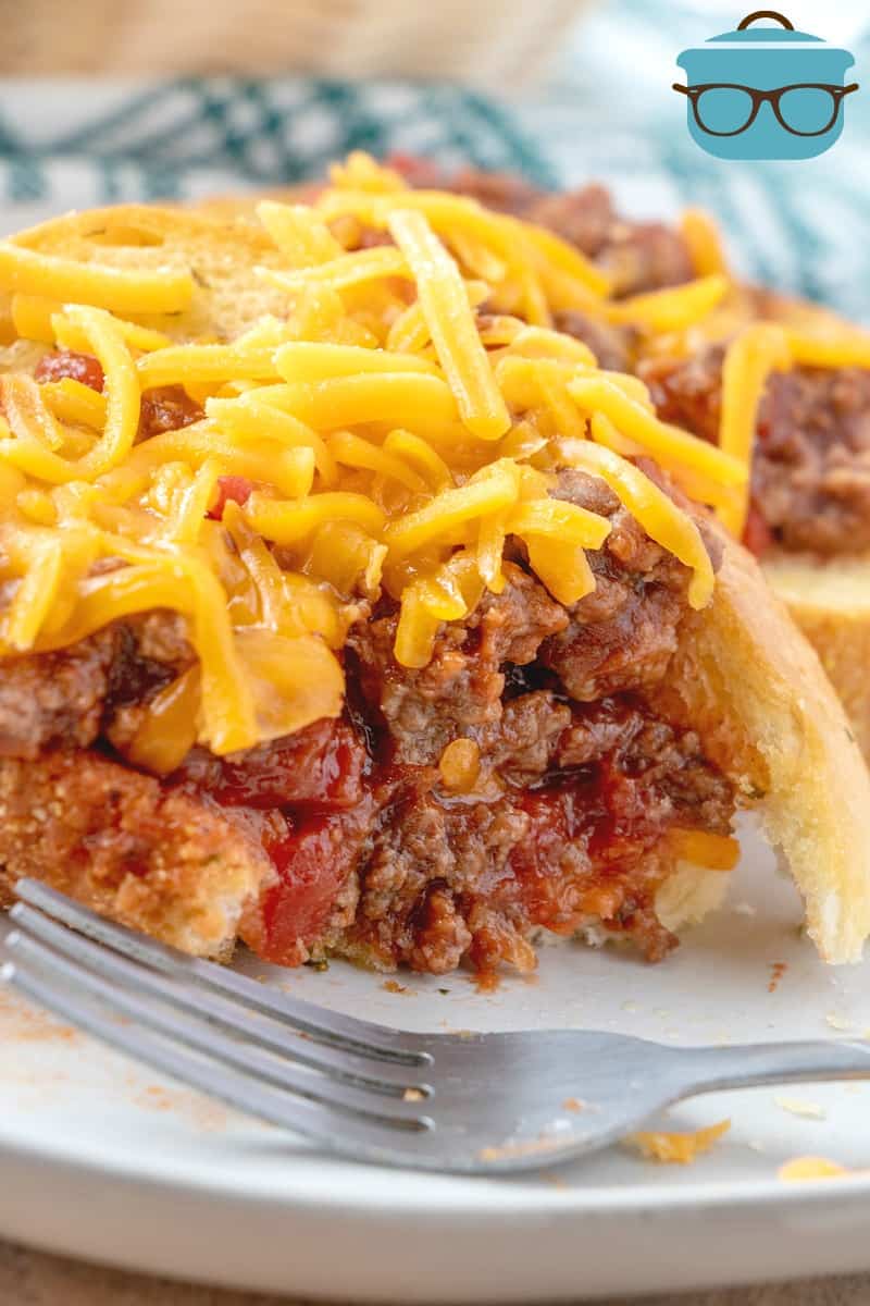 BBQ Sloppy Joe filling on top of garlic Texas toast with shredded cheddar cheese on top.