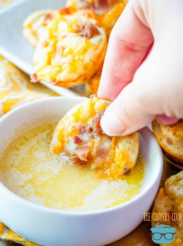 Cheesy Bacon Puffs dipped in butter