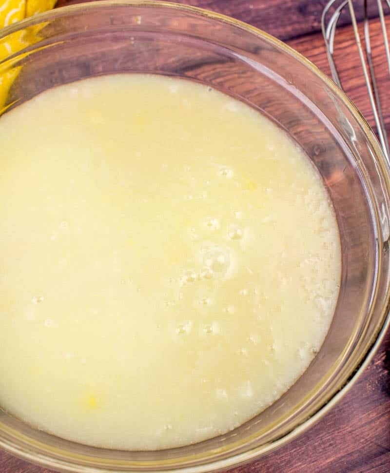 pineapple juice mix with sweetened condensed milk in a bowl.