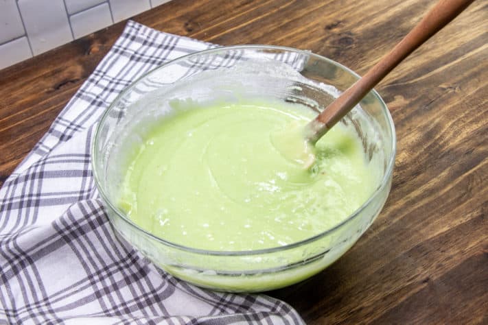 Pistachio cake batter in a bowl.