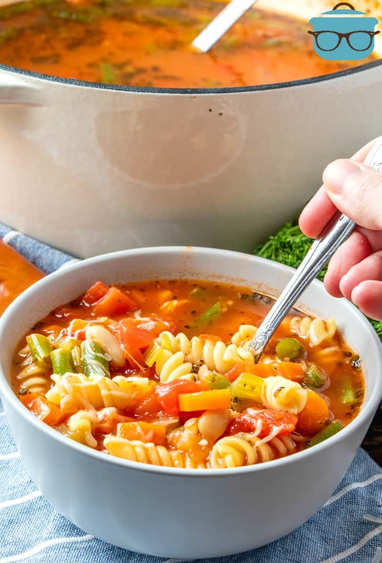 bowl of vegetable soup with spoon