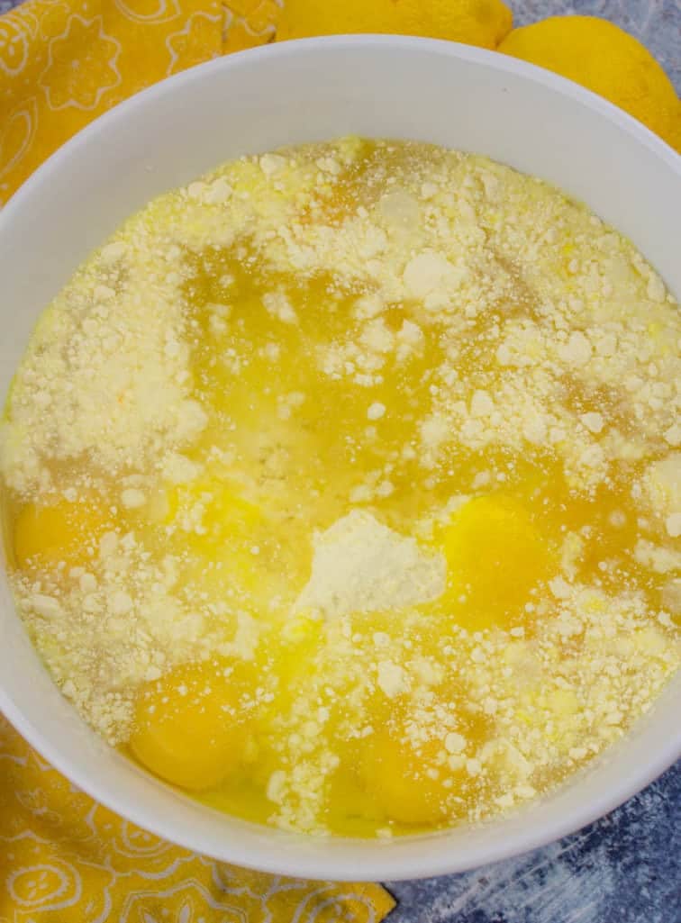 lemon cake mix, eggs, oil, lemon jello mixed together in a bowl