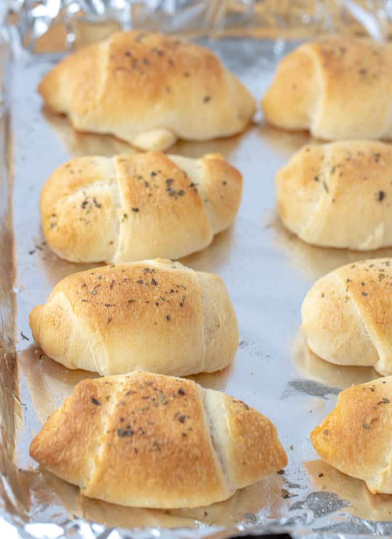 Crescent Pepperoni Roll Ups fully baked on a baking sheet.