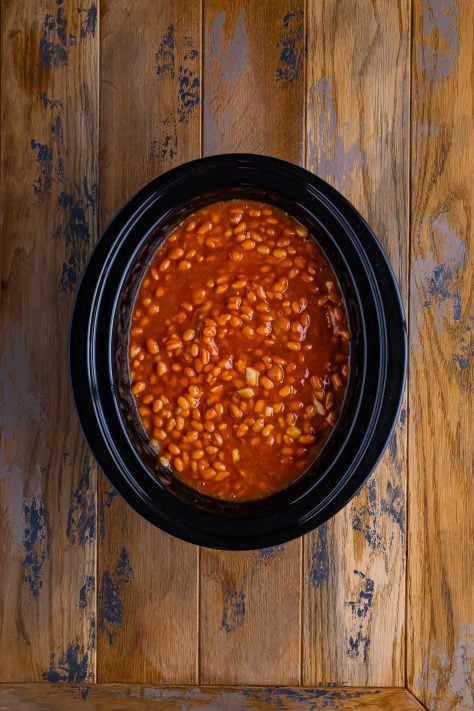 Stir baked beans ingredients in a Slow Cooker.