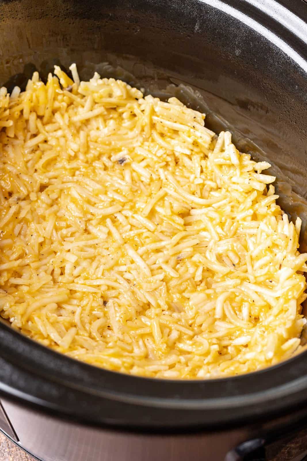 hash brown mixture spread into the bottom of the oval slow cooker. 