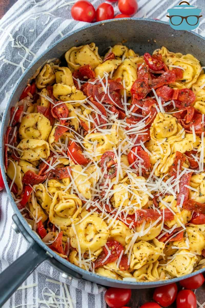 finished, Italian Cheese Tortellini Dinner with fresh tomatoes and garlic shown in a skillet.