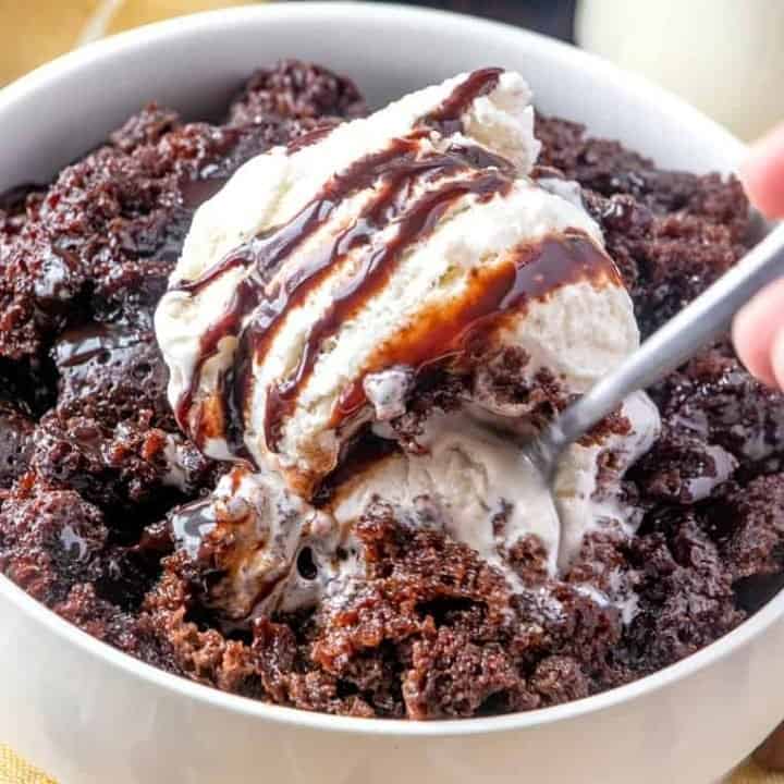Slow Cooker Chocolate Cake topped with a scoop of vanilla ice cream