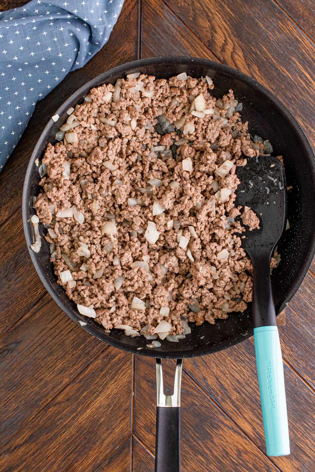 cooked ground beef and onions in a large skillet. 