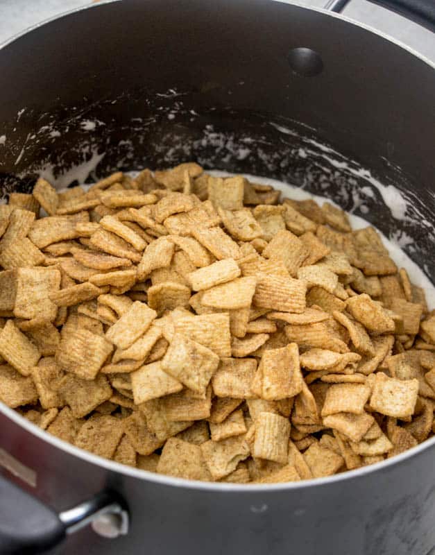 cinnamon toast crunch cereal added to marshmallow butter mixture