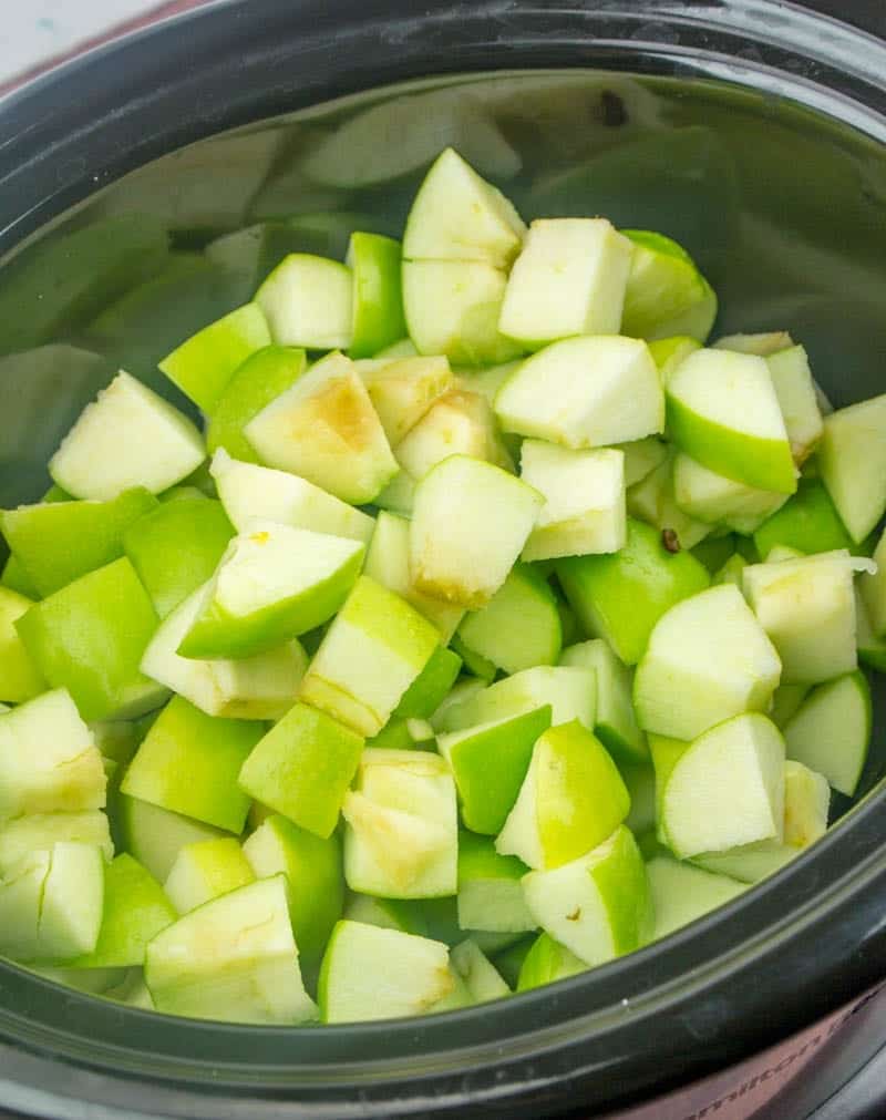 chopped Granny Smith apples in a 6-quart oval slow cooker.
