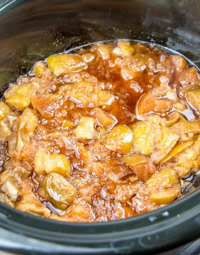 cooked apples with cinnamon and sugar in a crock pot.