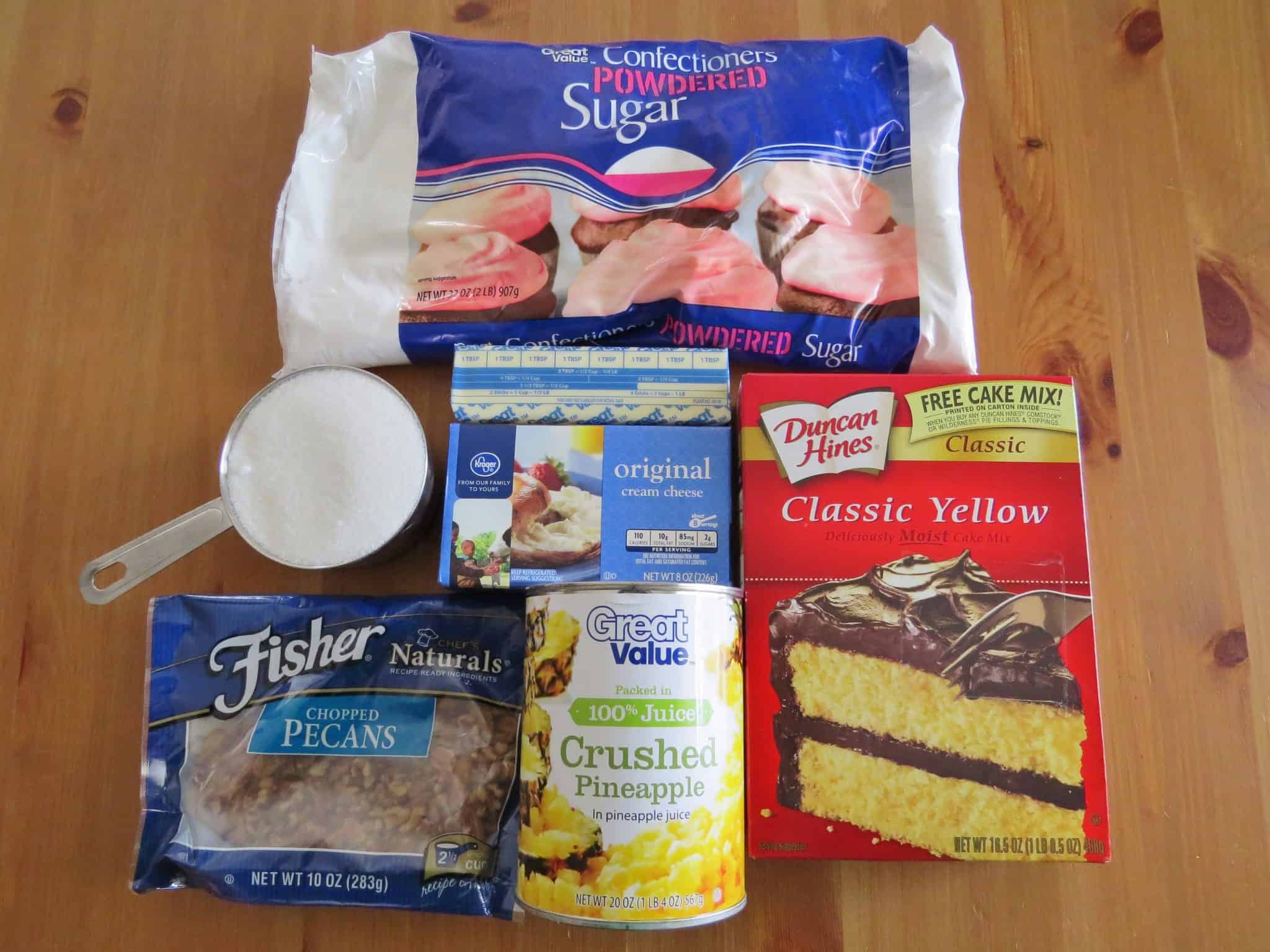 yellow cake mix, (ingredients needed to make cake; eggs, oil and water), crushed pineapple in juice (not heavy syrup), sugar, cream cheese, unsalted butter, powdered sugar, chopped pecans