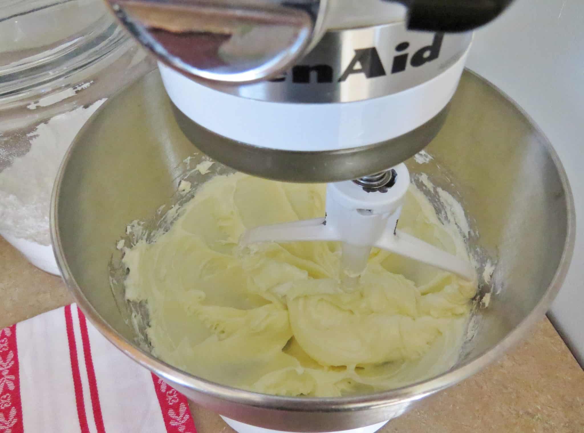 softened cream cheese and sugar mixed together in a Kitchen Aid stand mixer.