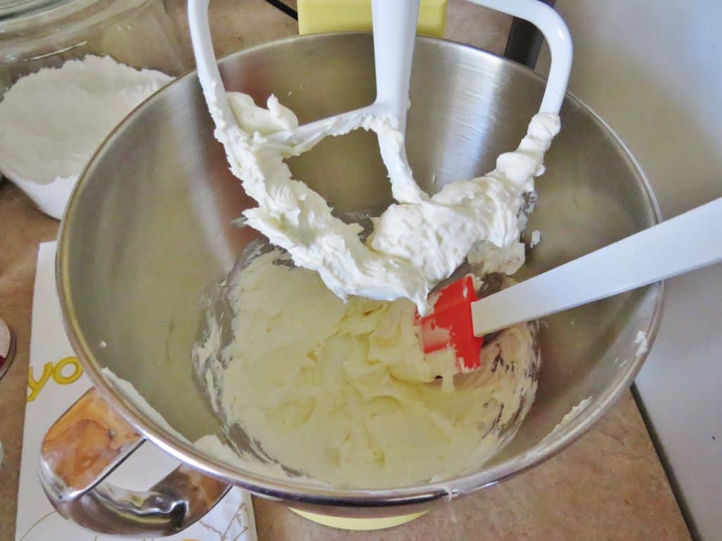 softened creamy cheese in an electric mixer