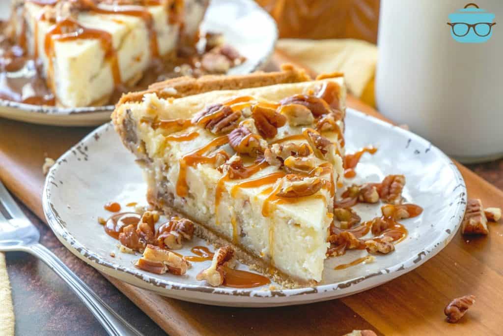 slice of Butter Pecan Cheesecake on a white plate