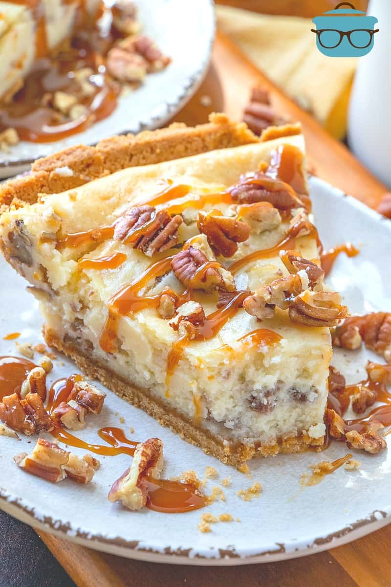 Easy Butter Pecan Cheesecake slice with a bite removed.