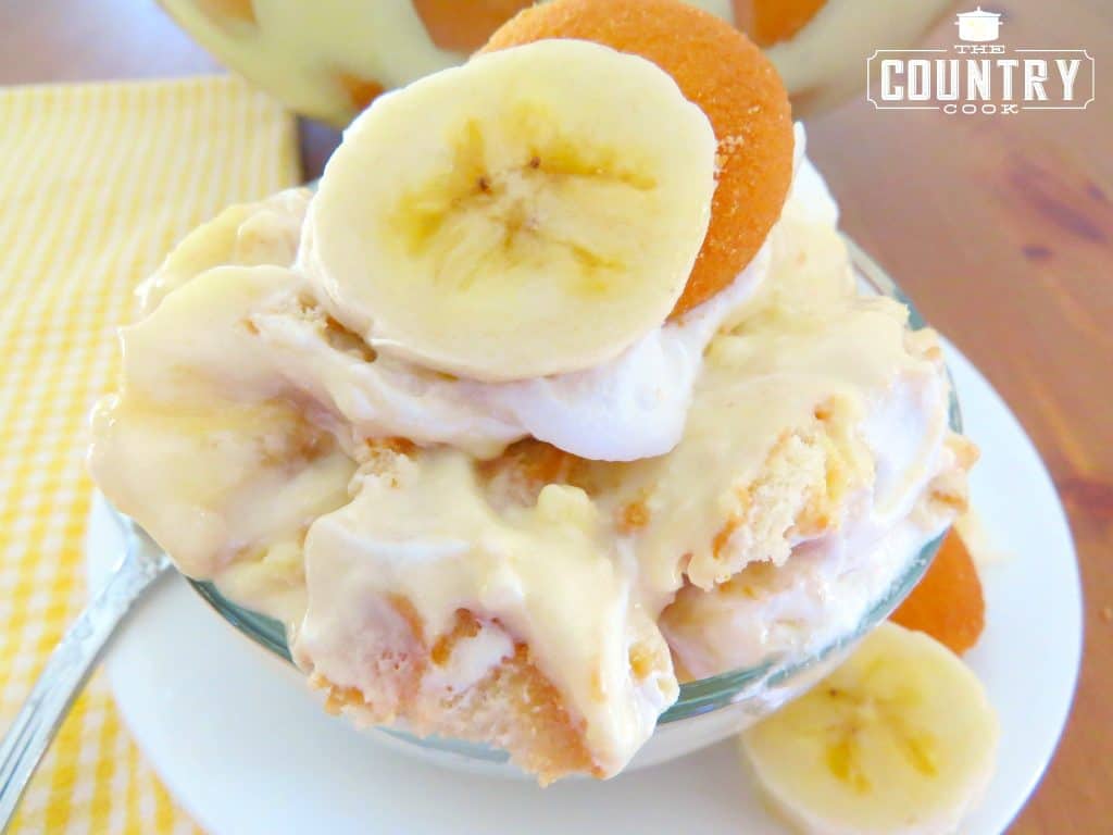 The Best Banana Pudding Recipe served in a bowl topped with a slice of banana and a Nilla Wafer 