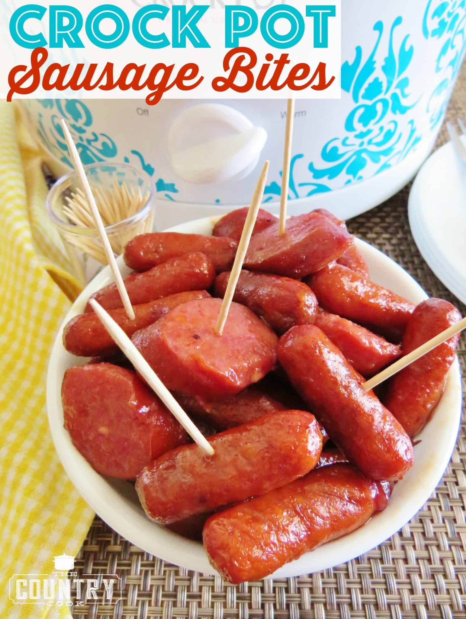 Crock Pot Sausage Bites shown with some toothpicks poked in a few and served in a small white bowl.