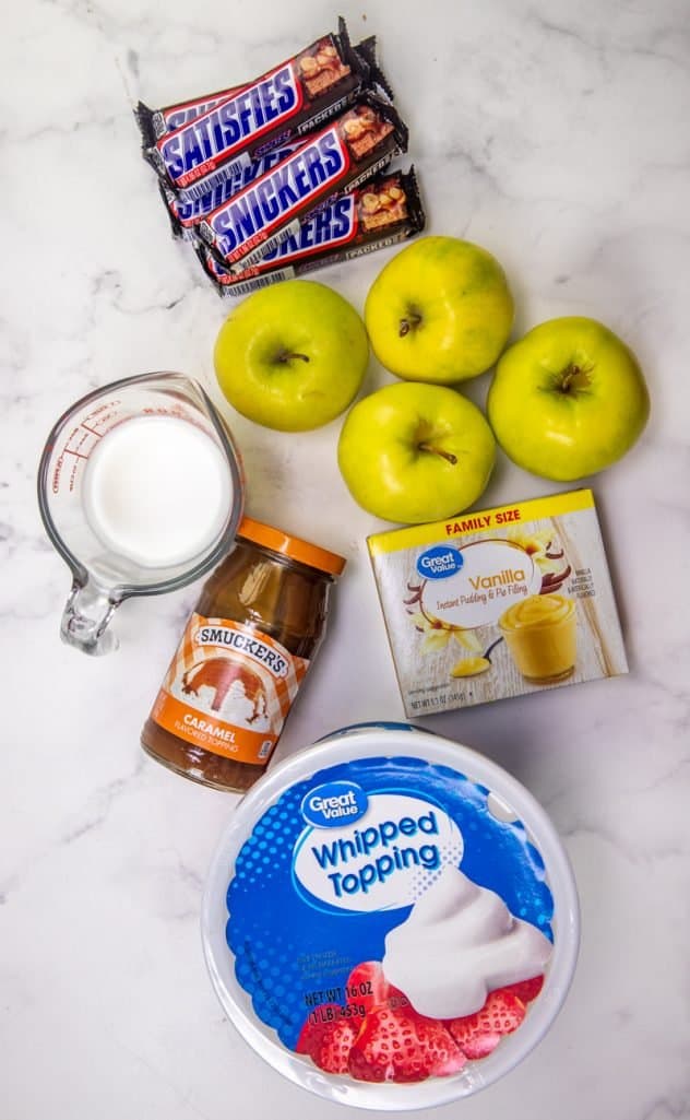 Instant vanilla pudding mix, milk, Cool Whip, whipped topping, golden delicious apples, Snickers candy bars, caramel sauce