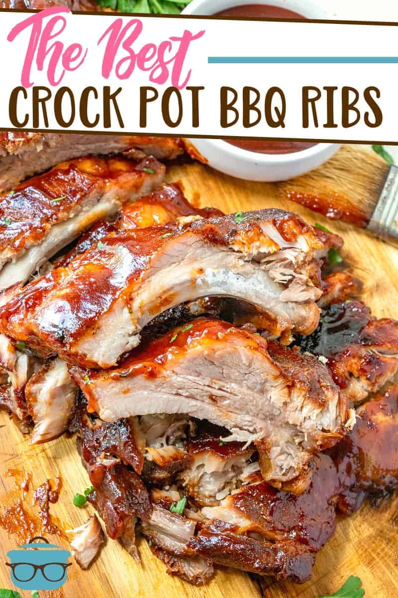 The Best Crock Pot Pork BBQ Ribs recipe from The Country Cook, pictured sliced and on a wooden serving platter.