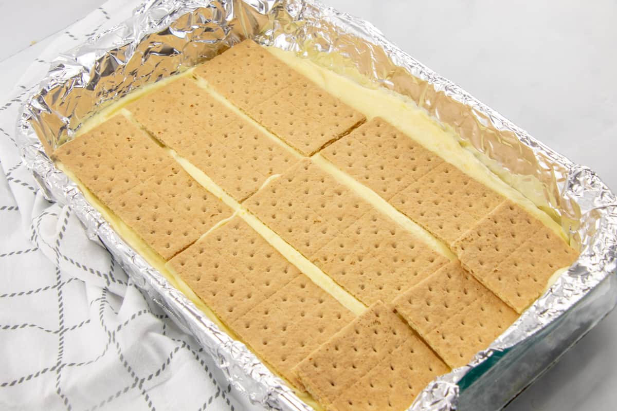 layer of graham cracker squares on top of vanilla pudding.