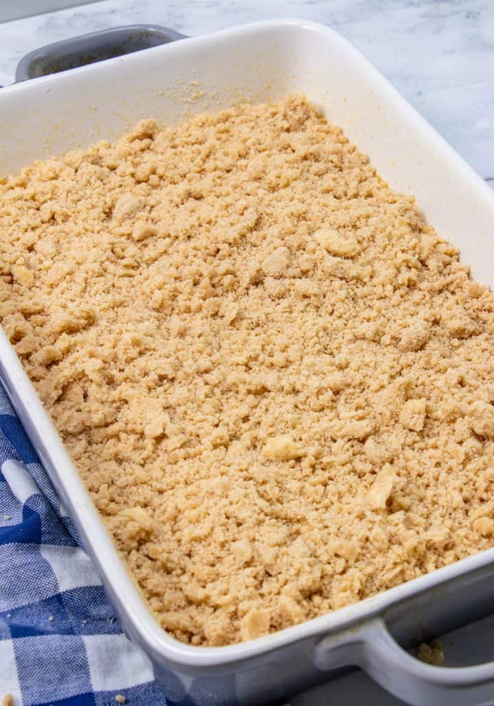 bown sugar crumb mixture sprinkled evenly of banana cake batter in a baking dish