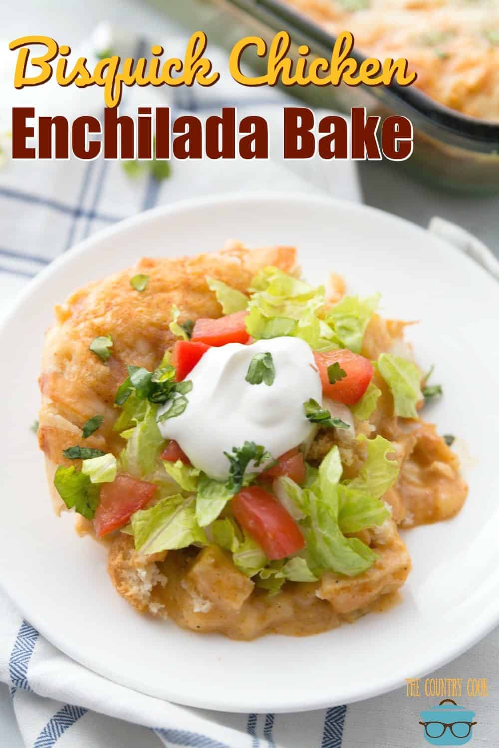 closeup photo of a serving of Bisquick Chicken Enchilada bake on a round white plate. 