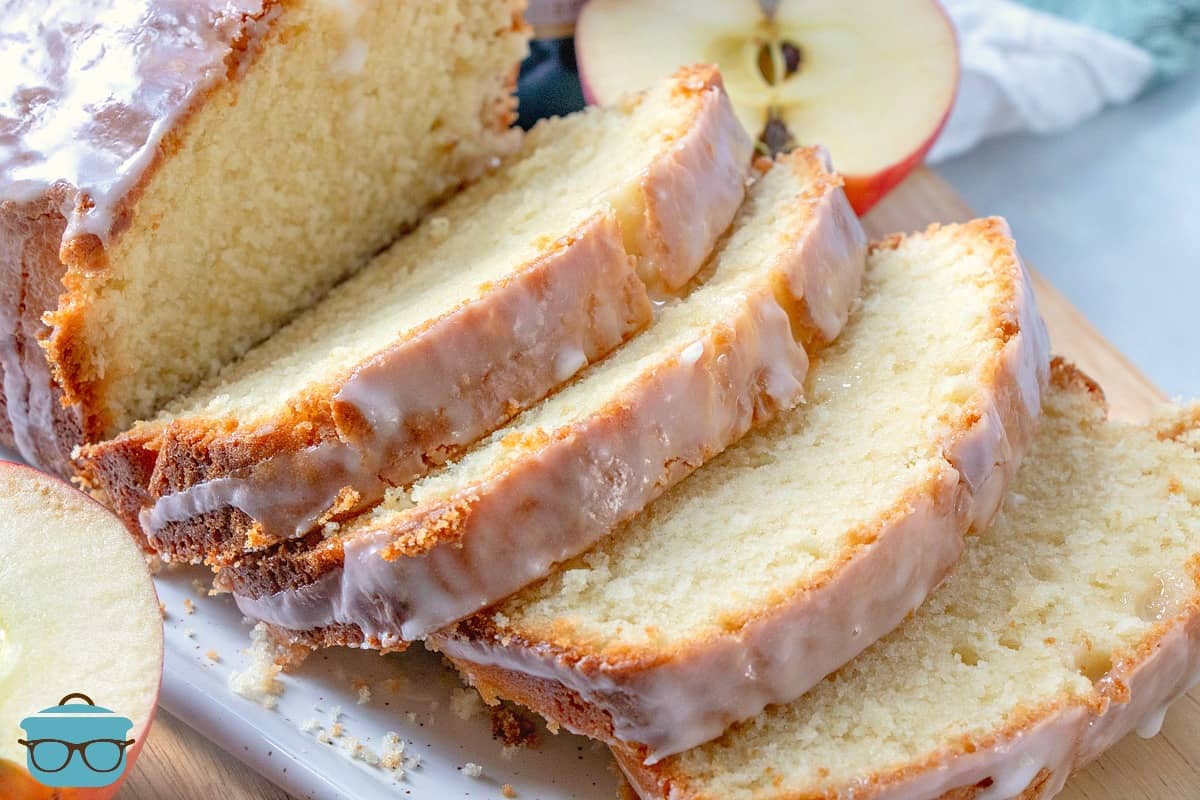 Apple Cider Pound Cake, sliced on a white platter.